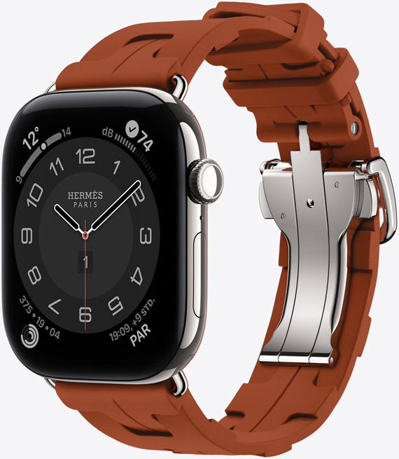 Apple Watch Hermès Series 12, analoges Circulaire Zifferblatt, (Stunden-, Minuten- und Sekundenzeiger, Komplikationen: Wetter, Geräusche, Aktivitätsringe und Paris Zeit), Titangehäuse, Farbe Silber, rechte Seitenansicht, Digital Crown, Seitentaste, kombiniert mit Kilim Single Tour Armband, Farbe Cuivre (Braun), geformtes Gummimaterial, geometrisches, ineinandergreifendes Design, silberfarbene Metallschließe