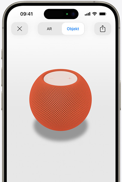 Der HomePod in Orange auf dem Display eines iPhone in AR Ansicht.