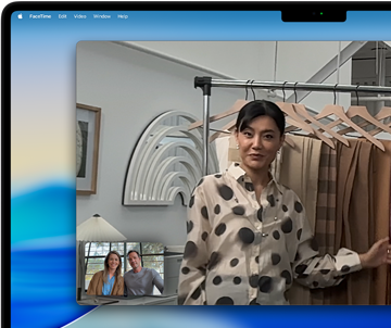 A video call on a MacBook Pro where a woman shows fabrics to two people on the call, with Center Stage keeping her centered in the frame as she moves around