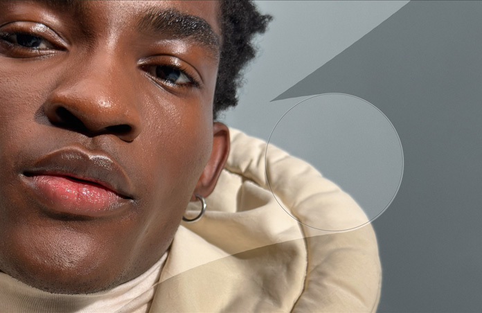 Close-up photo of man's face, retouching tools