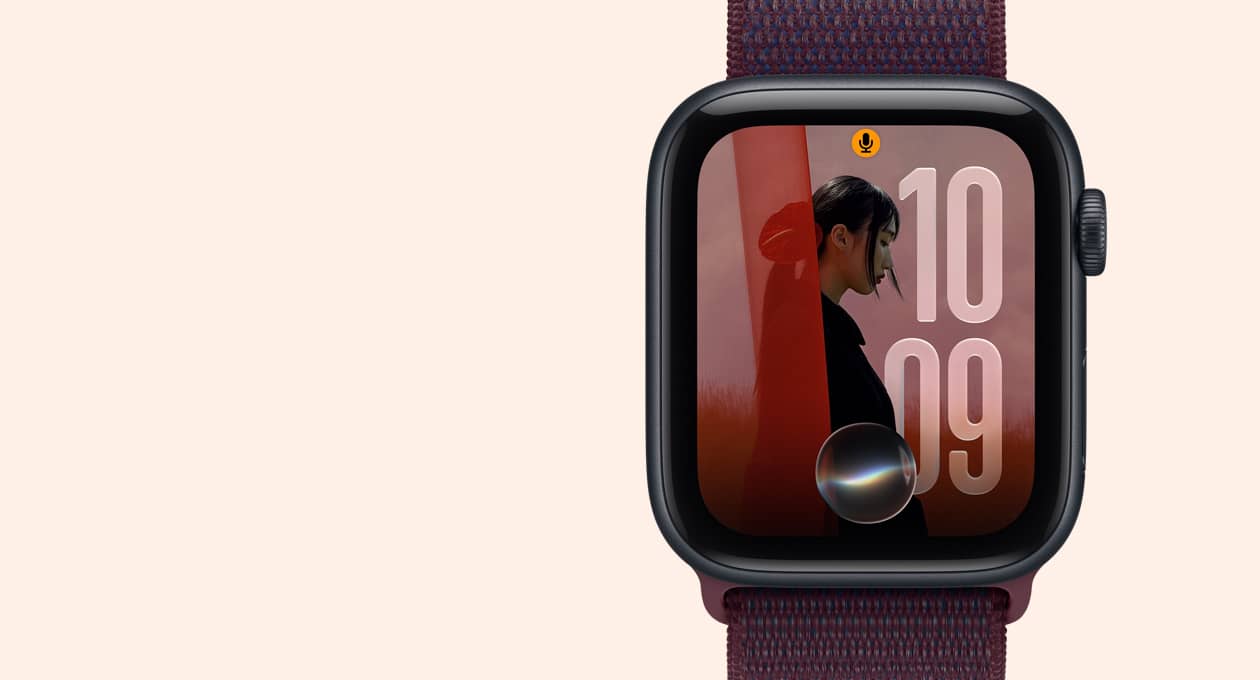 Apple Watch SE 3, aluminum case, midnight colour, screen shows photo image with Siri AI icon bottom centre