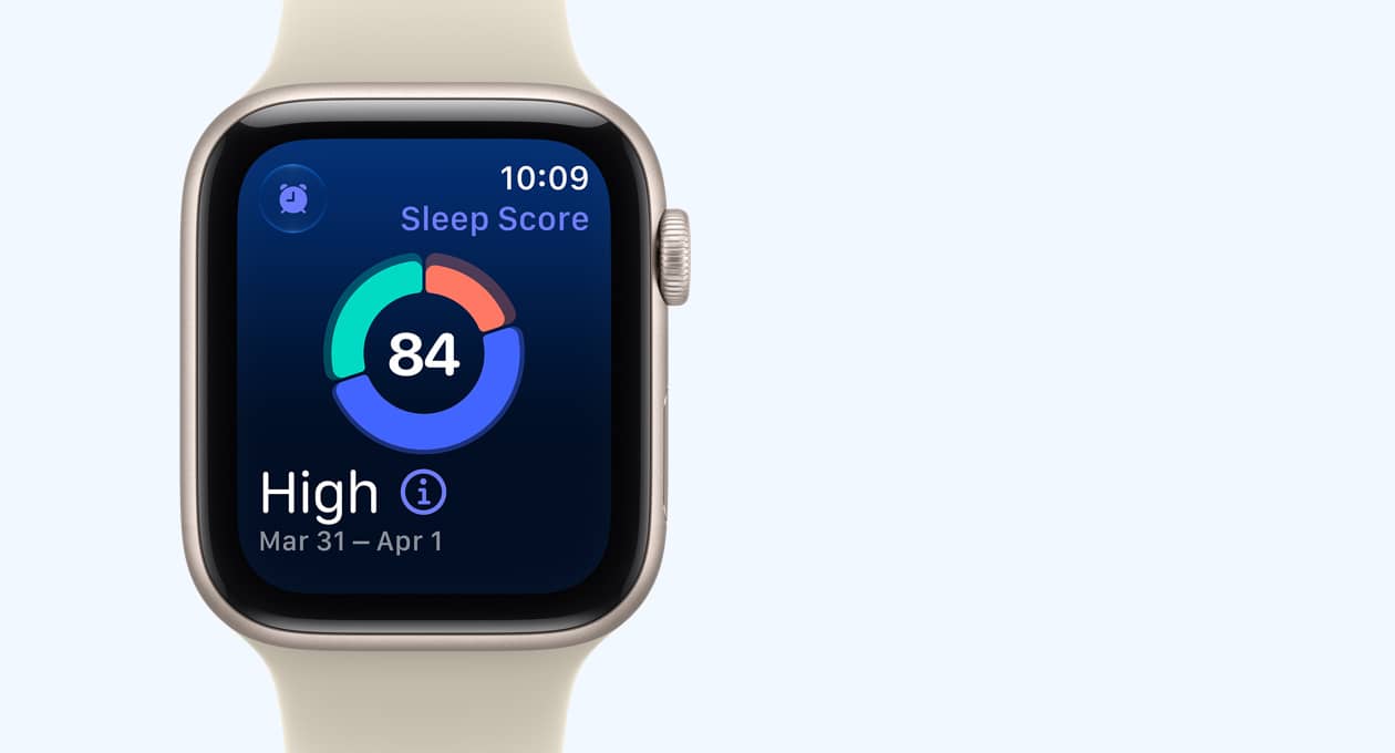 Apple Watch SE 3, aluminum case, starlight colour, screen shows sleep score circle graph, right side exterior, Digital Crown dial, Sport Band, sand colour (pale tan)