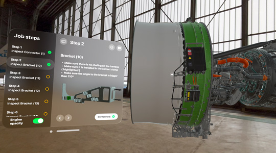 工場にて、ジェットエンジンの3Dプロジェクションが、一連の詳しい作業手順が示されたフローティングウインドウとともに表示されている