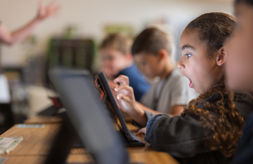 A student in Richardson Independent School District reacts to a lesson inspired by an Apple Learning Coach.
