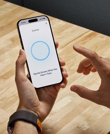 A person takes Hearing Test on their iPhone
