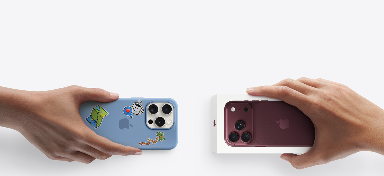 Due mani che si scambiano un iPhone 16 Pro usato color argento con custodia in silicone coperta di adesivi sul retro e un iPhone 18 Pro nuovo borgogna (rosso scuro) ancora nella confezione.