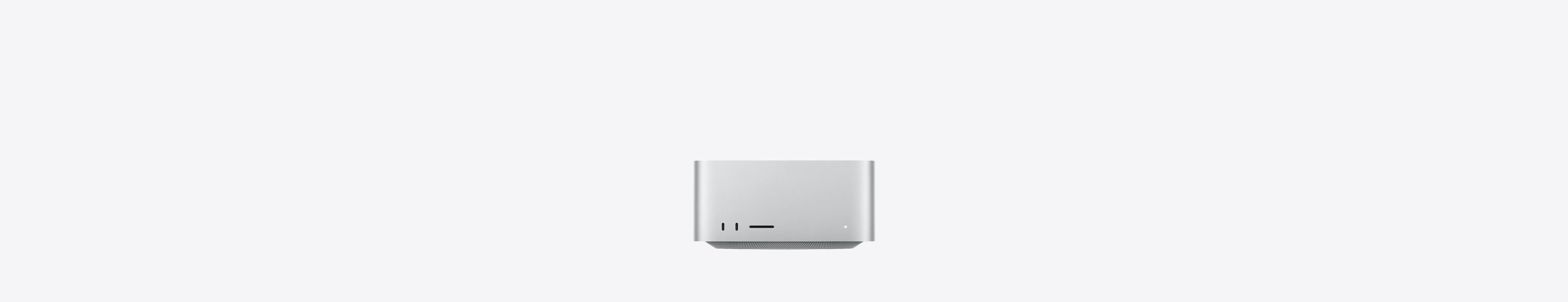 Mac Studio, front, two USB-C ports, SDXC card slot, status indicator light, tapered base at bottom, flat top, rounded sides, straight edges, silver color