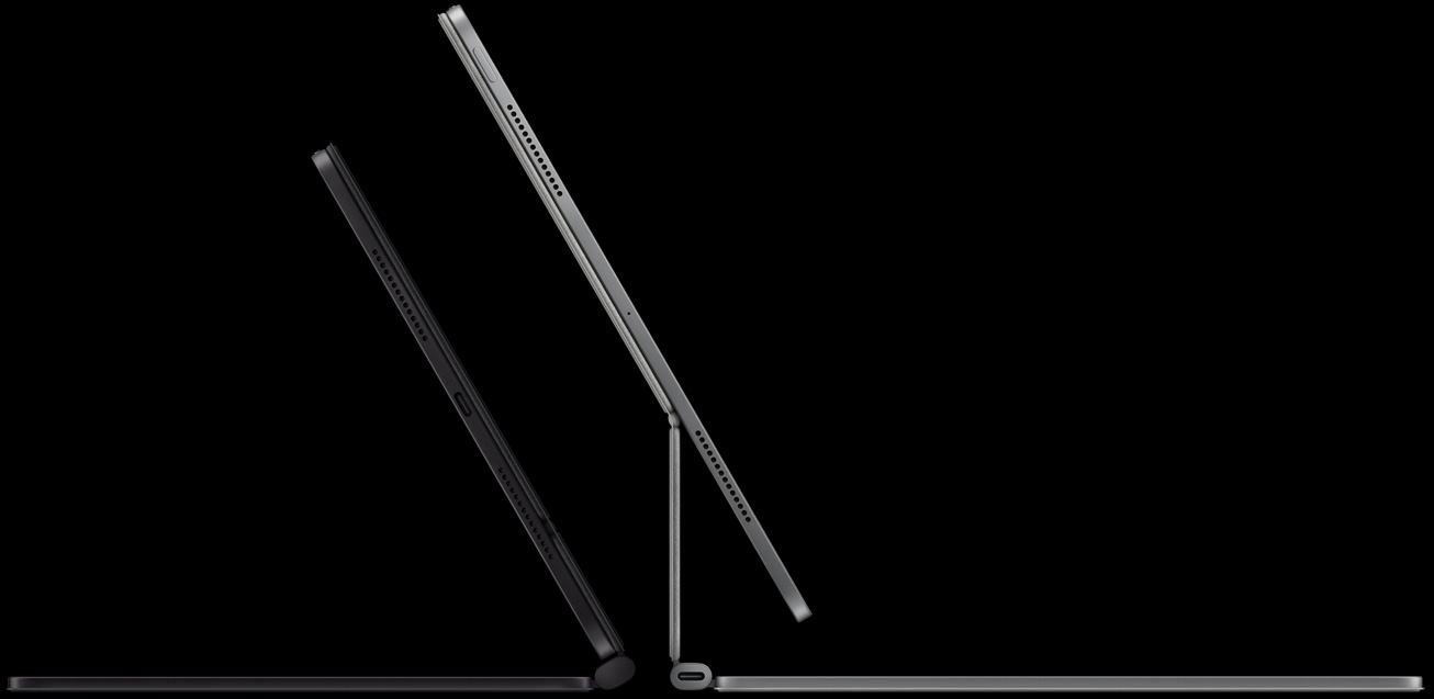2 iPad Pro devices attached to Magic Keyboard, left: iPad Pro, side exterior, space black color, microphones, attached to Magic Keyboard, side exterior, space black color, thin profile, iPad Pro tilted at 45-degree angle, right: iPad Pro, side exterior, silver color, microphones, attached to Magic Keyboard, side exterior, silver color, iPad Pro tilted at 45-degree angle showing the keyboard’s floating cantilever design and USB-C connector